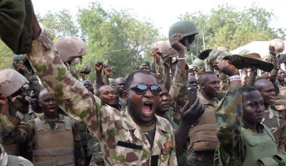 Brave Nigerian soldiers celebrate following the routing of Boko Haram fighters in the North east.