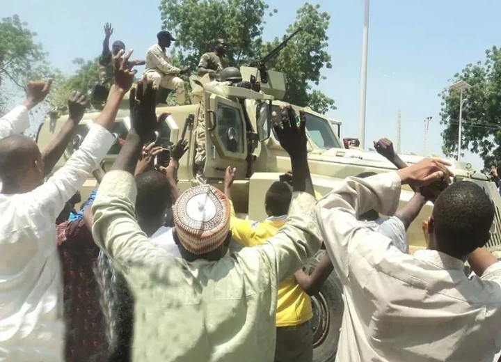 Nigerian troops being hailed by the Civilians in Borno State after successfully destroying the assault on the community by Members of Boko Haram