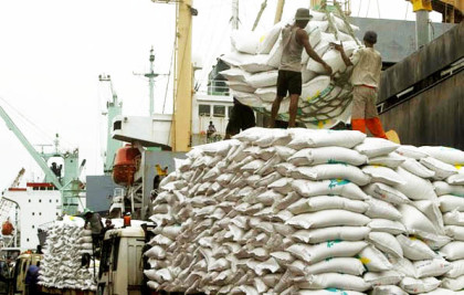 Workers unload 42,494 tonnes of Thai rice at the Tanjung Priok harbour in Jakarta