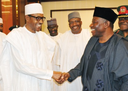PIC.16.PRESIDENT-ELECT RETIRED MAJ.-GEN. MUHAMMADU BUHARI (L) IN A HANDSHAKE WITH PRESIDENT GOODLUCK JONATHAN  DURING HIS OFFICIAL VISIT TO THE PRESIDENTIAL VILLA IN ABUJA ON FRIDAY (24/4/15).WITH THEM IS THE FORMER CHIEF OF ARMY STAFF,RETIRED LT.-GEN. ABDUHRAMAN DAMBAZAU.  2175/24/4/2015/ISE/CH/NAN