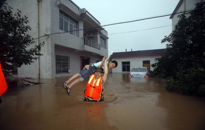 Pic shows:  Scenes of flooding in Ezhou, Hubei. Continuous rainfall in a Chinese city has caused flooding in a football stadium which now resembles a giant swimming pool. Reports said similar freak weather conditions have not been seen for decades, and tens of thousands are now being evacuated from their homes. Heavy storms in the city of Ezhou, in Central China’s Hubei Province, have inundated the streets with water and have caused serious disruptions to public transportation. Mingtang Stadium, the city’s landmark, is now also full of floodwater, making it look more like a bathtub than football grounds. Reports said it is the first time in 30 years, since the stadium’s completion, that it has ever been flooded, with waters covering the pitch and even reaching above the goal at either end. Incredible pictures of the open-roof stadium have since gone viral online, with netizens joking that the stadium seems to hold water quite well. But officials are desperately dealing with the aftermath of one of the wettest summers, with rainfall still continuing to batter the city where 27 people have died and 16 are unaccounted for as a result of the weather. The city’s meteorological bureau has issued ongoing storm warnings, with reports saying tens of thousands have been evacuated and relocated. Since the beginning of July at least 14 provinces have reported floods and landslides caused by non-stop rainstorms, which some regions experiencing 300 millimetres of rainfall in just 24 hours. (ends)