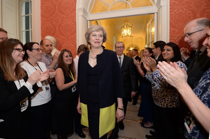 Staff clap as new Prime Minister Theresa May walks into 10 Downing Street, London, after meeting Queen Elizabeth II and accepting her invitation to become Prime Minister and form a new government. PRESS ASSOCIATION Photo. Picture date: Wednesday July 13, 2016. See PA story POLITICS Conservatives. Photo credit should read: Stefan Rousseau/PA Wire